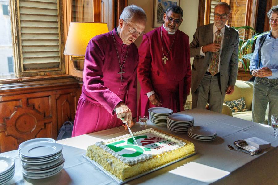 The Most Revd Justin Welby, Archbishop of Canterbury cuts a cake celebrating the 50th anniversary of the library’s foundation during his visit to the Anglican Centre in Rome for the opening of John Moorman Memorial Library exhibition. 