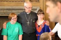 Justin Welby with two members of Hand in Hand worship group 