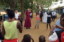 Archbishop Justin Welby singing with children at a church-run centre for children affected by Ebola. 