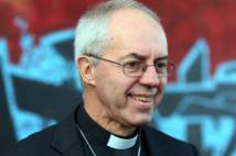 Archbishop Justin at the peace wall in Cupar Way, West Belfast.