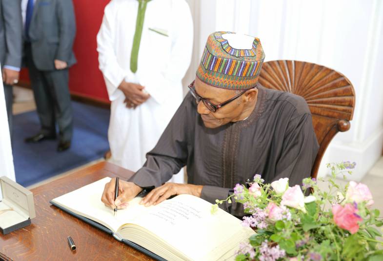 President Muhammadu Buhari signing LP Guest book