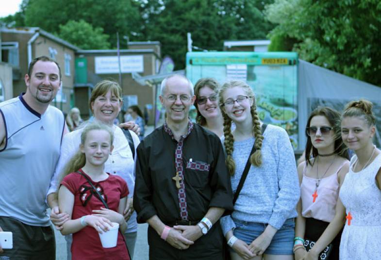 Young people grab a photo with Archbishop Justin as he walks around the Soul Survivor festival site. 