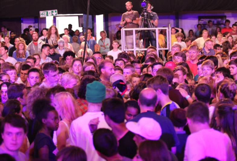 Four thousand young people gather around to pray for Archbishop Justin during evening worship at Soul Survivor festival. 