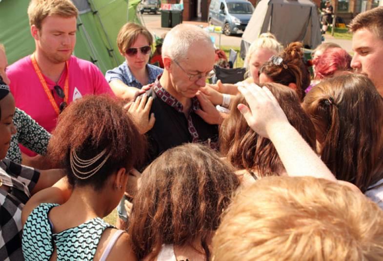 Young people attending Soul Survivor pray for Archbishop Justin.