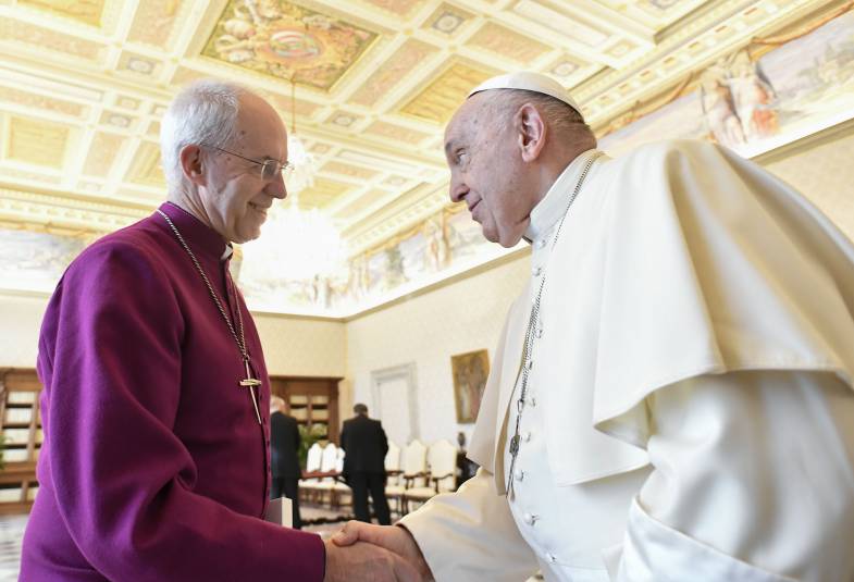 The Archbishop of Canterbury, Justin Welby, shaking hands with Pope Francis ahead of a private meeting at the Vatican