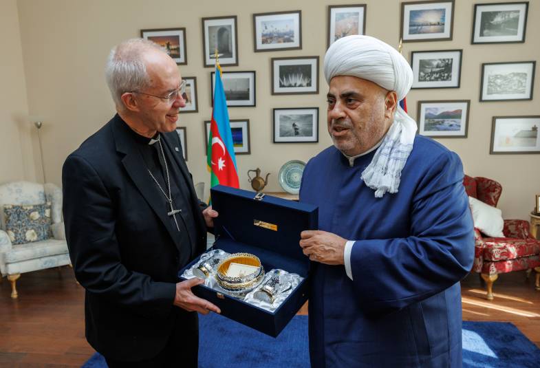 Haji Allahshükür Hummat Pashazade, the Sheikh ul-Islam and Grand Mufti of the Caucasus presents The Most Revd and Rt Hon Justin Welby, Archbishop of Canterbury with a present after a lunch reception with faith leaders hosted by HE Fergus Auld, British Ambassador to Azerbaijan at the Ambassadors Residence in Baku, Azerbaijan.