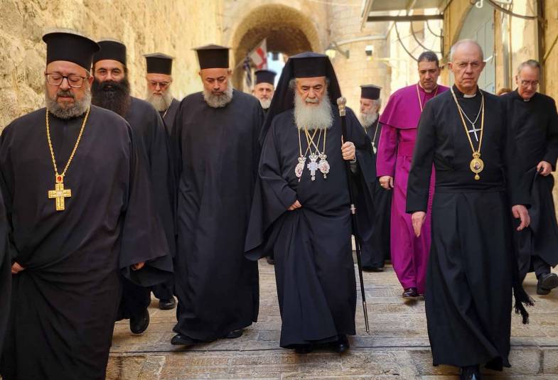 Archbishop Justin and Patriarch Theophilus walking through Jerusalem