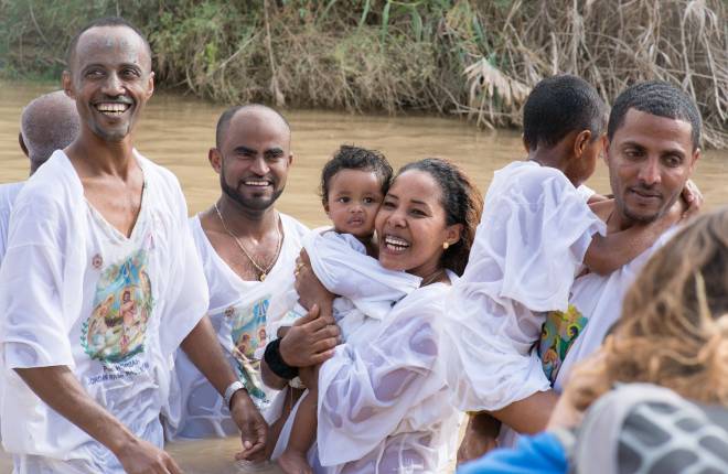 Pilgrims being baptised in the Jordan River (Credit: HALOTrust)