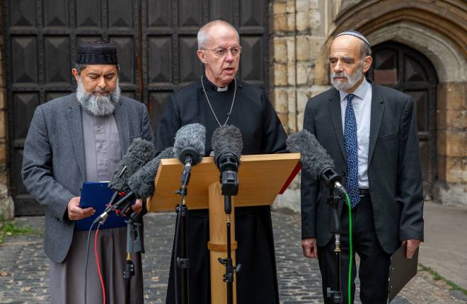 The Most Revd Justin Welby, Archbishop of Canterbury, Sheikh Ibrahim Mogra and Rabbi Jonathon Wittenberg join together outside Lambeth Palace to deliver statements rejecting anti-semitism and hate crimes of all sorts with special reference to tensions and emotions around the current situation in the Middle East. 